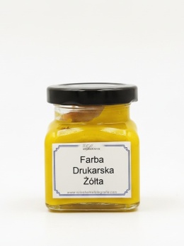 Szklany słoik z czarną zakrętką i etykietą producenta, zawierający farbę drukarską w kolorze żółtym o wadze 100 g na jasnym tle.